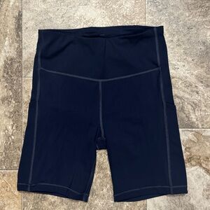 Athleta Navy Blue Ultimate Stash pocket 7” Bike Shorts
